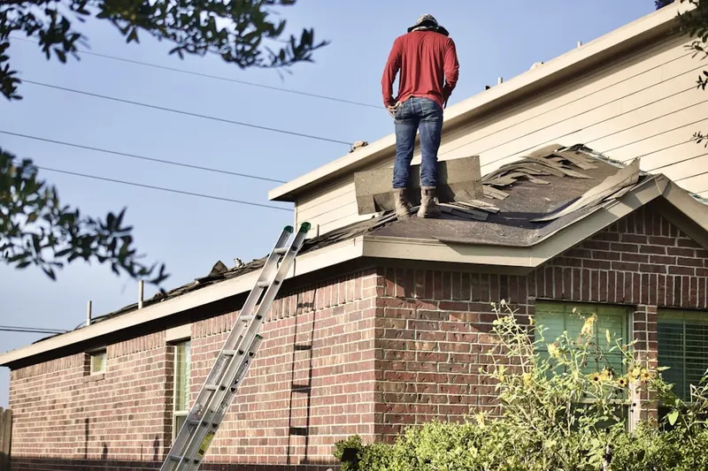 Professional roofer working on a residential roof in Lawrenceburg Junction